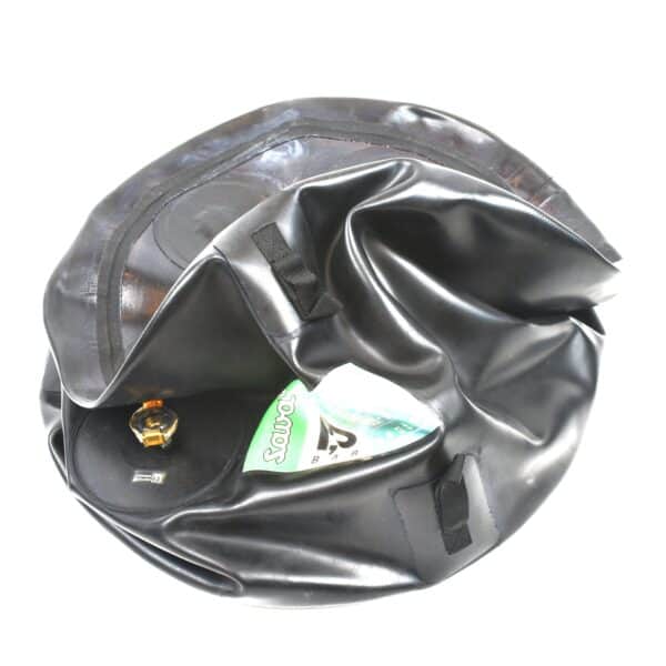Deflated black inflatable object with an air valve, perfect for tactical rescue training, featuring a transparent pocket holding packaging.