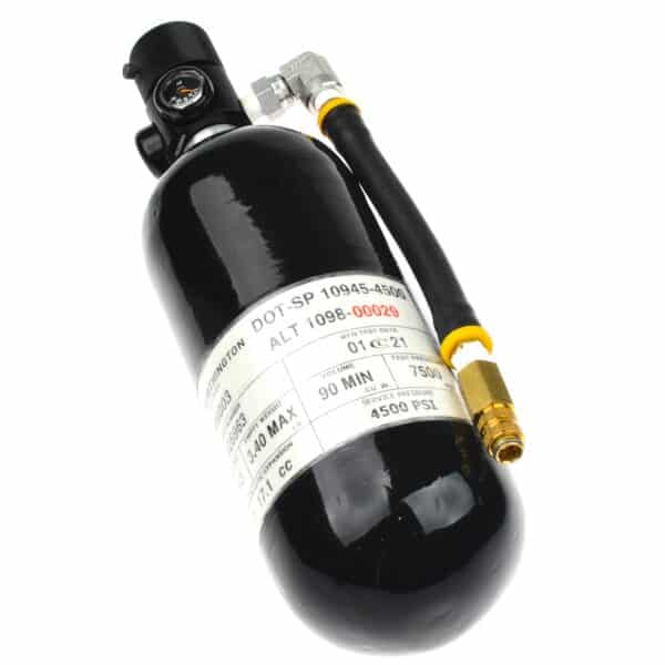 A black compressed gas cylinder with a gauge and hose, featuring a white label, used in professional safety training.