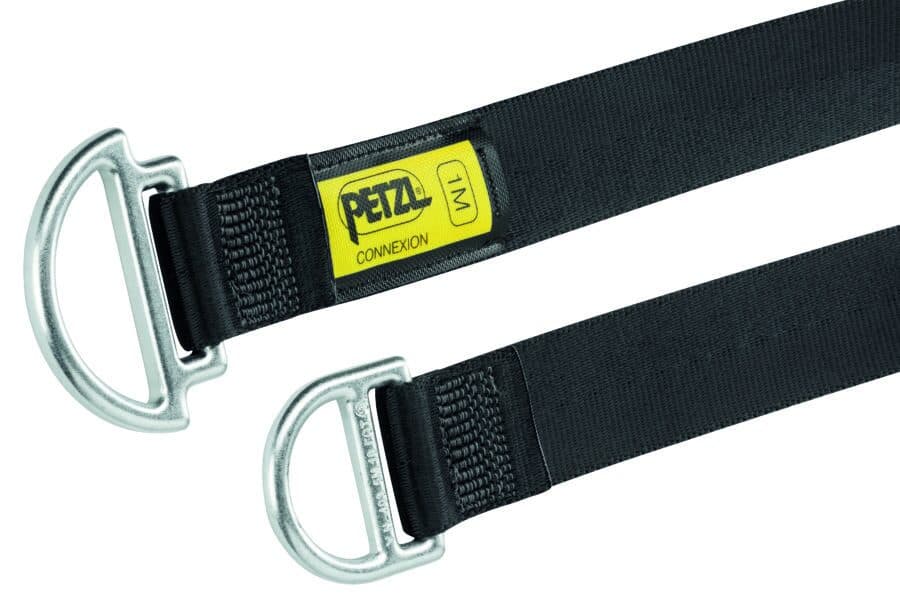 A black Petzl Connexion anchor strap with metal D-rings at each end and a yellow label marked 
