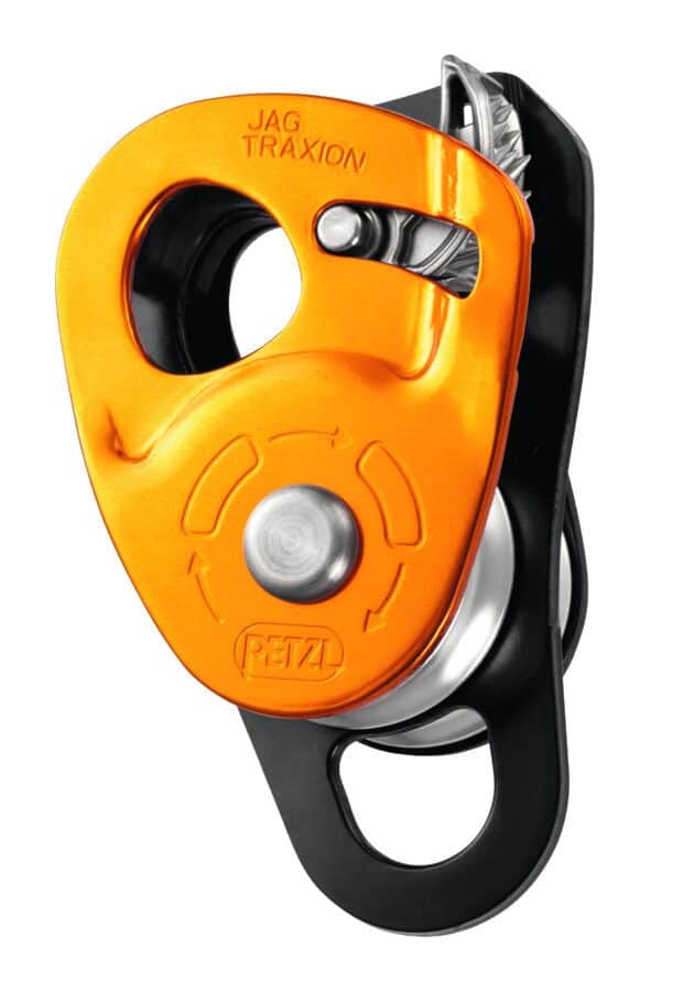 Close-up of an orange and black mechanical pulley with a silver component, labeled 