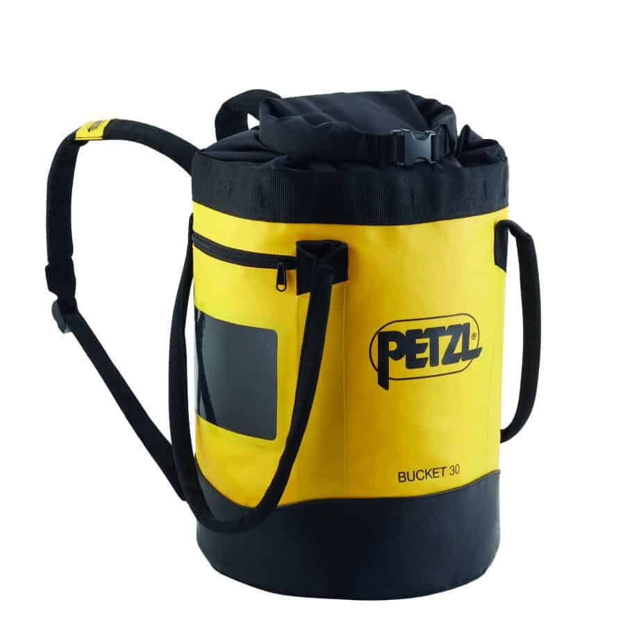 Yellow and black Petzl bucket bag with shoulder straps and a front pocket, ideal for tactical rescue training, featuring a drawstring closure at the top.