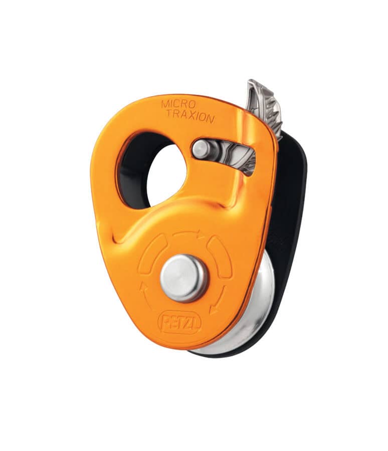 Orange and black climbing pulley with a toothed cam, labeled 