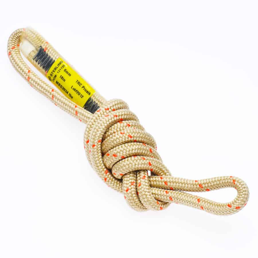 A coiled beige climbing rope with red threading, a yellow label, and a secure knot for onsite technical rescue standby teams against a white background.