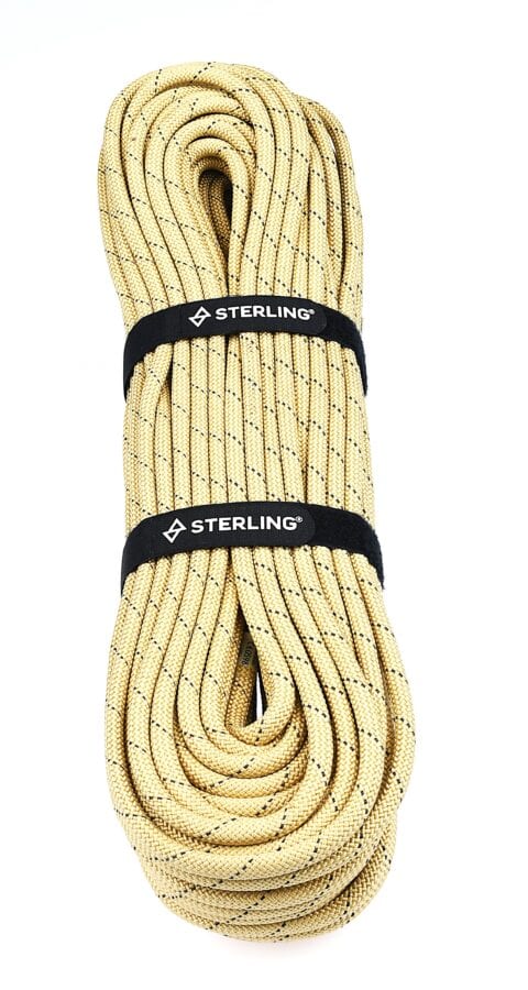 Coiled beige rope with black speckles, secured by two black straps labeled 