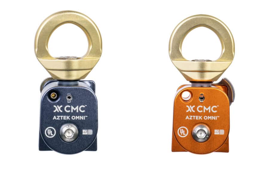Two CMC Aztek Omni pulleys are displayed: left in blue, right in orange, ideal for tactical rescue training with circular attachment points on top.